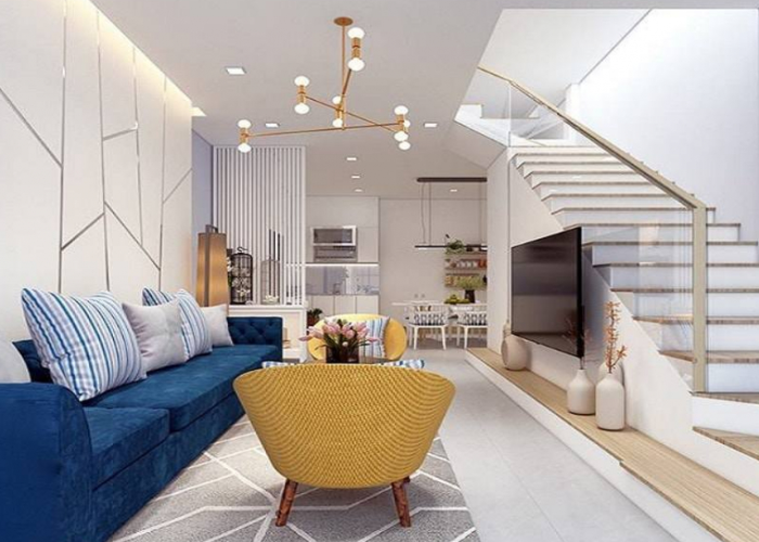 Với tông màu trắng kết hợp sắc xanh của ghế sofa tạo cho phòng khách thêm phần hiện đại