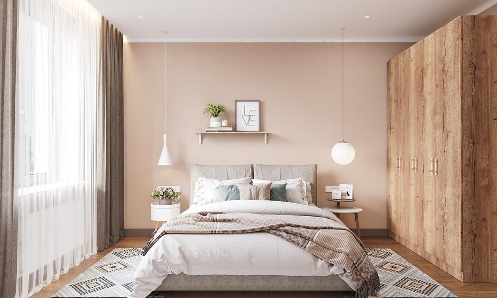 Thiết kế phòng ngủ đơn giản, hiện đại cho nữ với nội thất gồm giường bọc vải hiện đại, tủ quần áo gỗ và kệ treo tường và vài phụ kiện trang trí. 