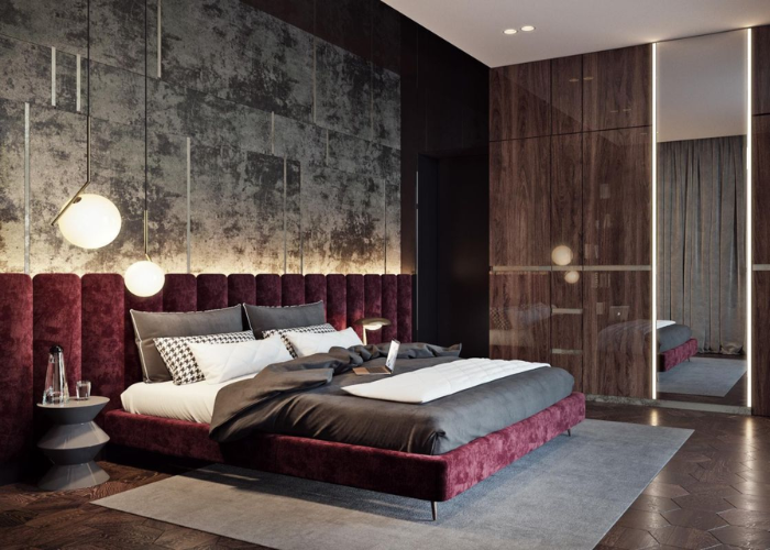 Không gian phòng ngủ với màu gỗ trầm ấm kết hợp với nội thất pha màu đỏ đô tạo nên cá tính riêng cho gia chủ