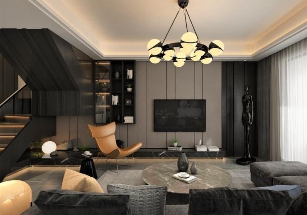 Decor phòng khách tông đen bằng đèn chùm sắc vàng sẽ mang đến cảm giác ấm áp và dịu dàng hơn