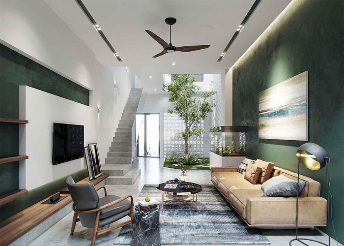 Kết hợp tone xanh trắng với bày trí nội thất đơn giản giúp cho không gian phòng khách nhà ống 5m có cầu thang thêm xanh mát