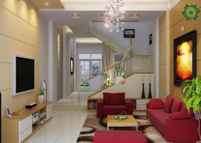 Thiết kế phòng khách nhà ống 5m2 có cầu thang với sofa đỏ là ý tưởng táo bạo
