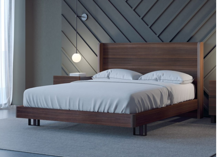 Xu hướng thiết kế nội thất phòng ngủ đơn giản với chiếc giường, kệ để đèn làm bằng gỗ lim chắc chắn.