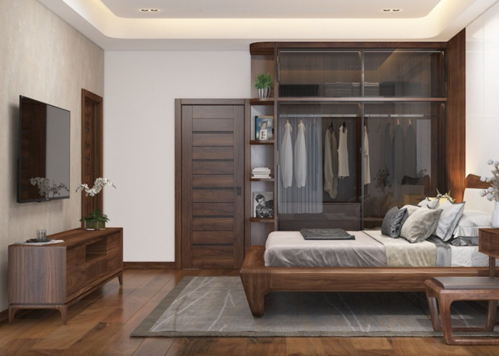 Tủ quần áo gỗ tự nhiên đụng trần kết hợp với cửa kính trong suốt giúp tăng sự sang trọng.