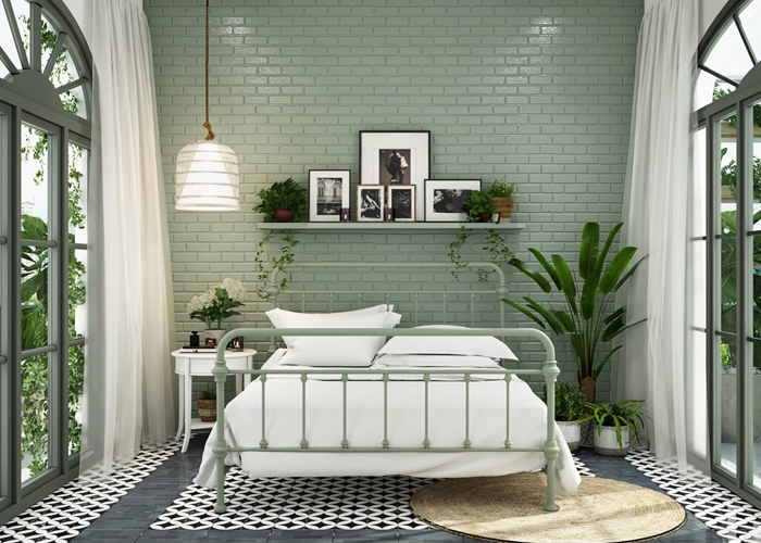 Mẫu không gian phòng ngủ xanh lá sử dụng xốp dán tường giả gạch với gam màu xanh pastel cực kỳ bắt mắt.