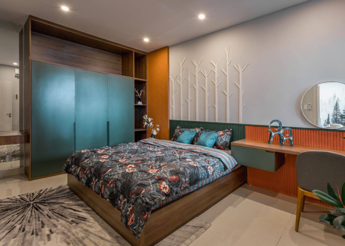 Phòng ngủ với tủ đựng đồ màu xanh cổ vịt kết hợp với chiếc ga giường cách điệu