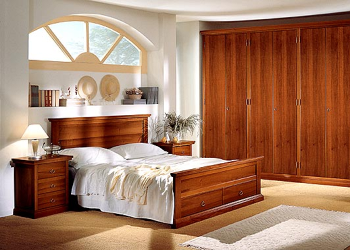 Tủ đầu giường gỗ tự nhiên, cùng chất liệu với nội thất trang trí của căn phòng tạo nên sự đồng nhất và tinh tế.