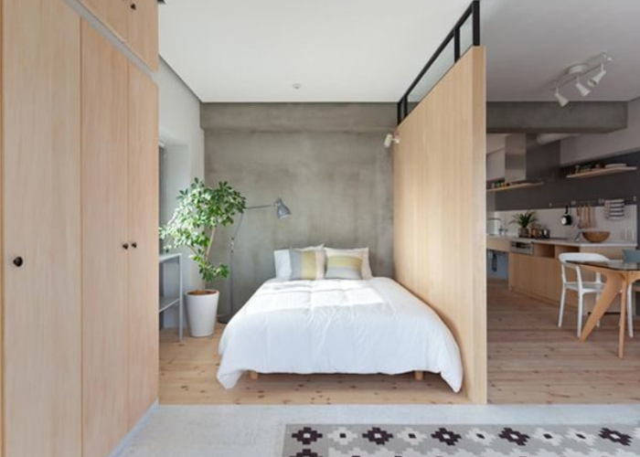 Mẫu vách ngăn giữa bếp và phòng ngủ chất liệu gỗ công nghiệp, đơn giản và hài hòa với tổng thể thiết kế nội thất